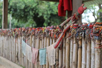 Close-up of multi colored flags hanging outside temple