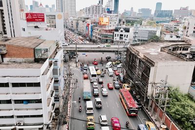 High angle view of traffic on road amidst buildings