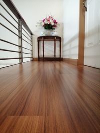 Empty chair on hardwood floor at home