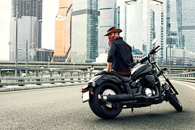 Full length of man riding motorcycle