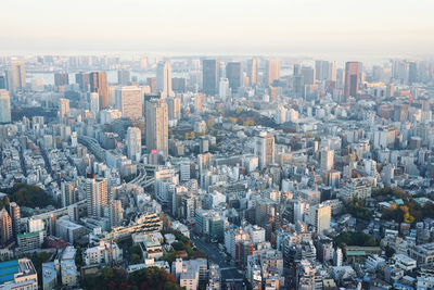 High angle view of modern buildings in city against sky