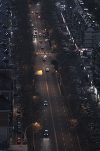 High angle view of illuminated city street at night