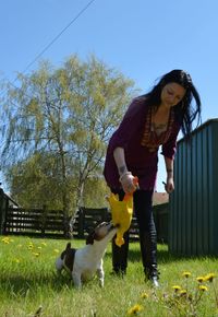 Full length of woman standing on field