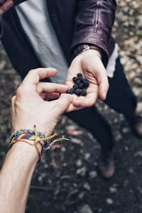 Midsection of woman holding hands