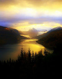 Scenic view of mountains at sunset