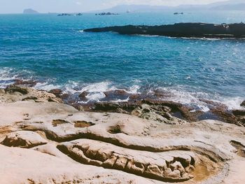 High angle view of sea shore against sky