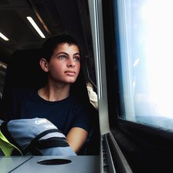 Young woman sitting in train