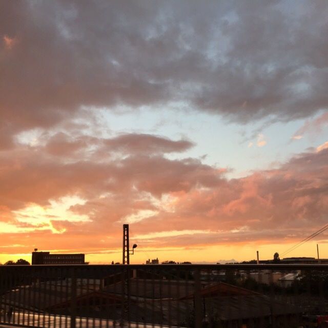 sunset, orange color, sky, architecture, built structure, cloud - sky, building exterior, silhouette, dramatic sky, cloudy, cloud, city, low angle view, beauty in nature, nature, scenics, outdoors, no people, moody sky, overcast