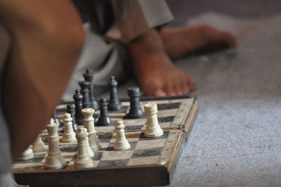 Cropped image of men playing chess