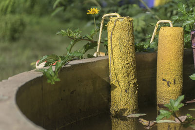 Close-up of old wooden post on field