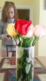 Close-up of woman holding flowers