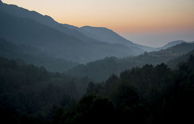 Scenic view of mountains against sky during sunset