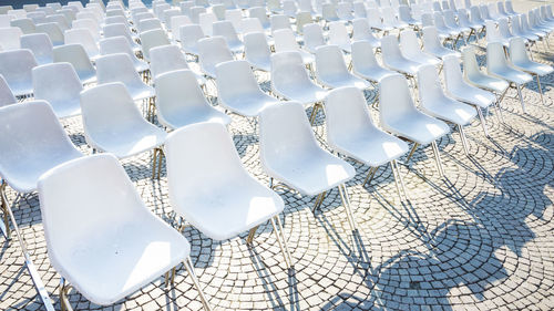 Full frame shot of empty chairs arranged outdoors