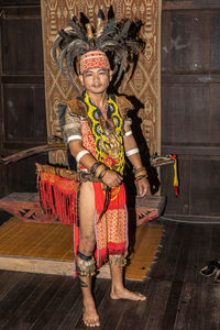 Full length portrait of a smiling young woman