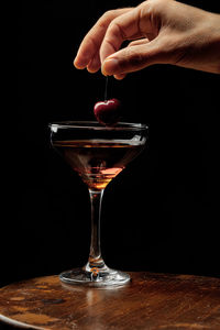 Cropped hand of woman holding wineglass