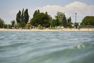 Scenic view of swimming pool by sea against sky