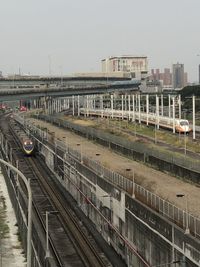 High angle view of train in city against sky