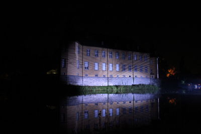 Reflection of illuminated buildings in water