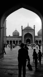 Group of people in front of historical building