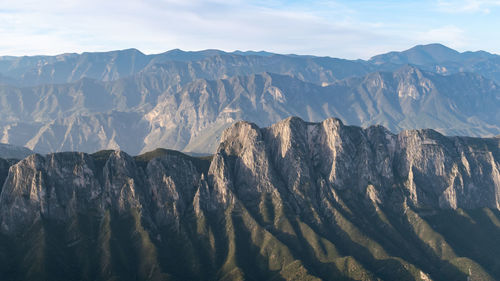 View of mountain range against cloudy sky