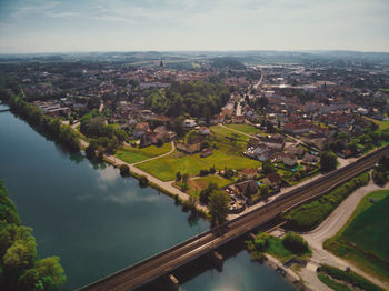 High angle view of river amidst buildings in city