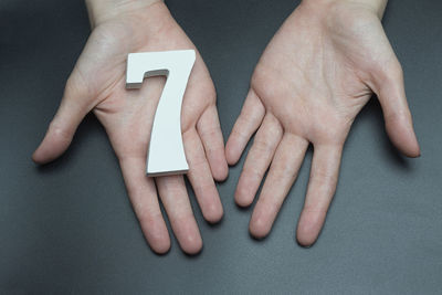 Close-up of woman hand on table