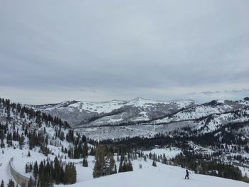 Scenic view of snow covered mountains against sky