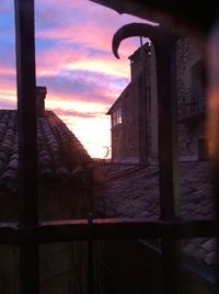 Built structure against sky at sunset