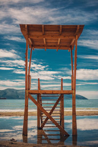 Pier over sea against sky