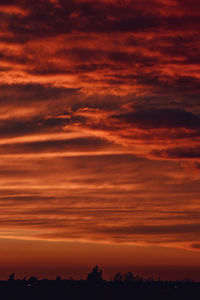 Low angle view of dramatic sky during sunset