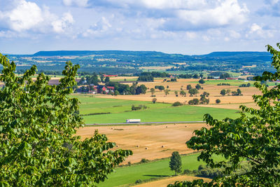 Truck driving on a country road in a rural area from a high angle view