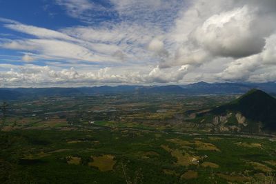 Scenic view of mountains against cloudy sky