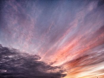 Low angle view of dramatic sky during sunset