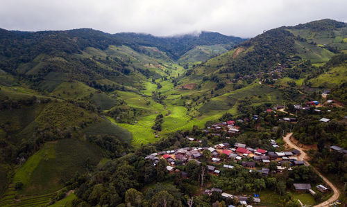 High angle view of trees and houses against sky