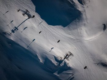 High angle view of people skiing on snowcapped mountain