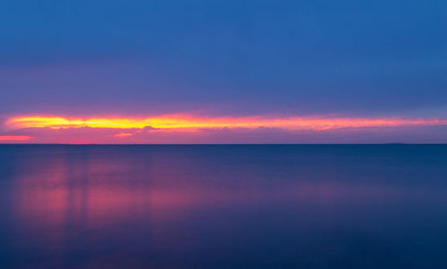 Scenic view of sea against sky at sunset