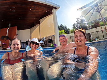 Group of senior people enjoying in the swimming pool