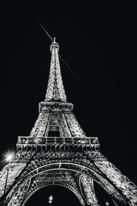 Low angle view of communications tower at night