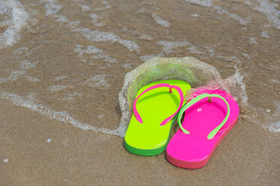High angle view of flip-flops at beach