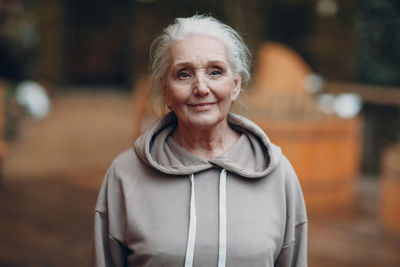 Portrait of smiling woman standing outdoors