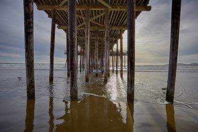 Pier on sea against sky