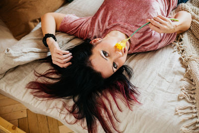 Young woman enjoys herself sitting at home during self-isolation, lockdown, because of covid19.