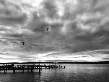 Scenic view of sea against cloudy sky