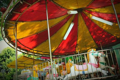 Low angle view of horses at carousel