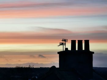 Chimney against pastel skies