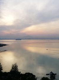 Scenic view of sea against sky at sunset