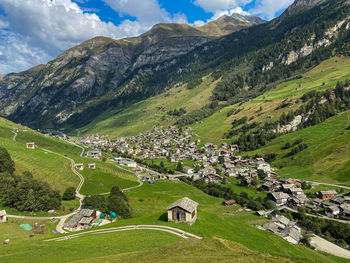 Scenic view of landscape and mountains against sky