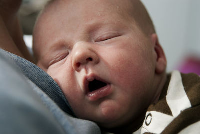 Close-up portrait of cute baby sleeping