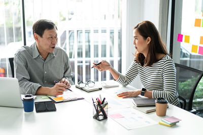 Business colleagues having discussion at office