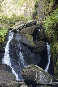 Scenic view of stream flowing through rocks